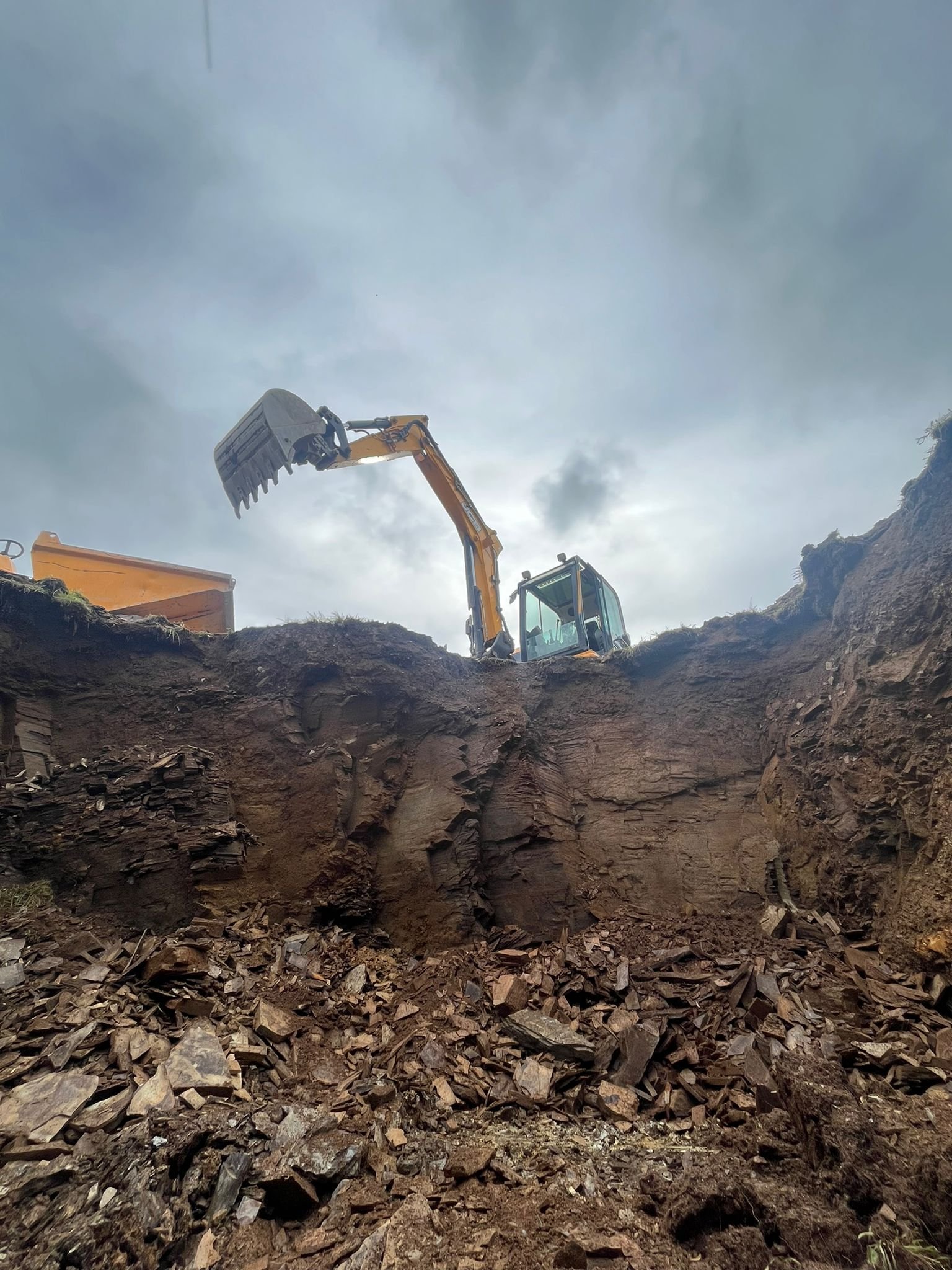 Excavator completing site clearance and groundwork